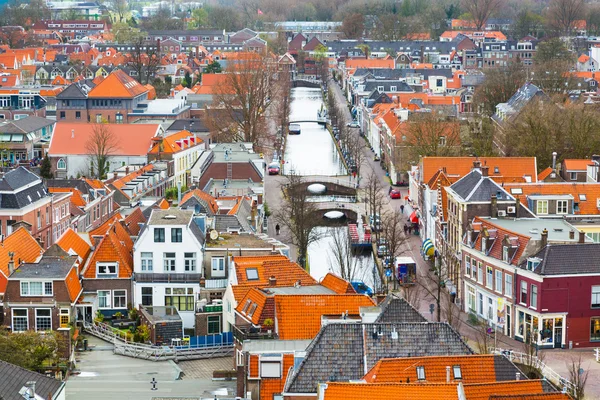 Aerial panoramic street view with canal and houses in Delft, Holland