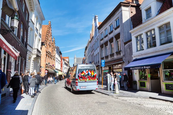 Colorful Hop-on hop-off Sightseeing City Tours bus in Bruges, Belgium