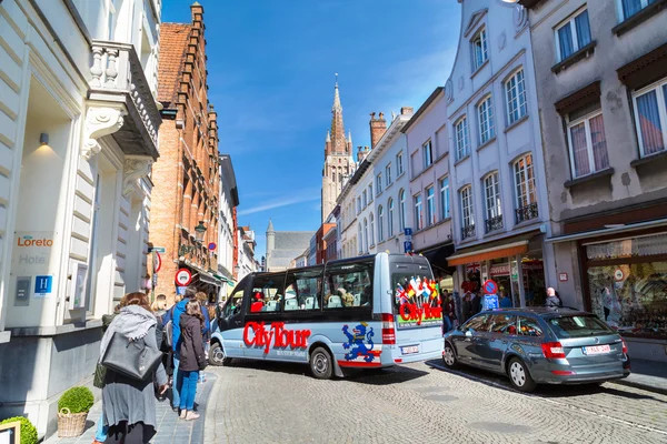 Colorful Hop on hop off Sightseeing City Tours bus in Bruges, Belgium