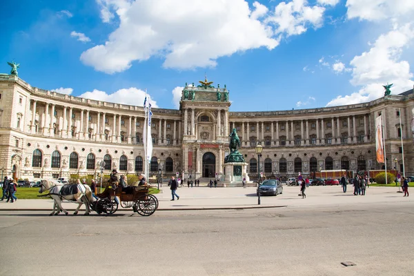 Hofburg palace, square view and fiacre or fiaker in Vienna