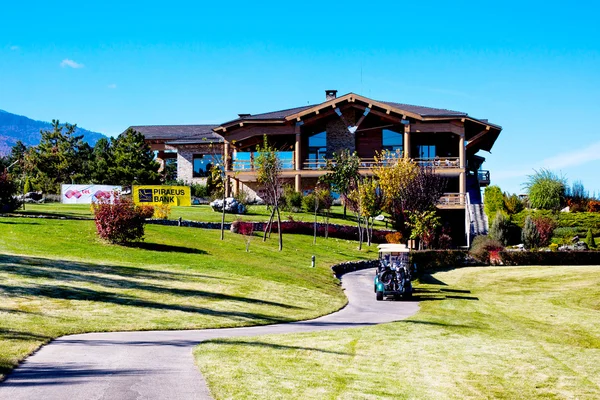 Pirin Golf Club house and restaurant, trees, golf cart, blue sky