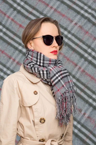 Autumn woman wearing scarf and sunglasses