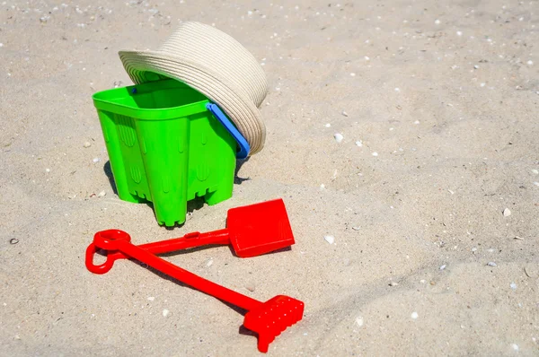 Sandpit kit in sand with summer hat