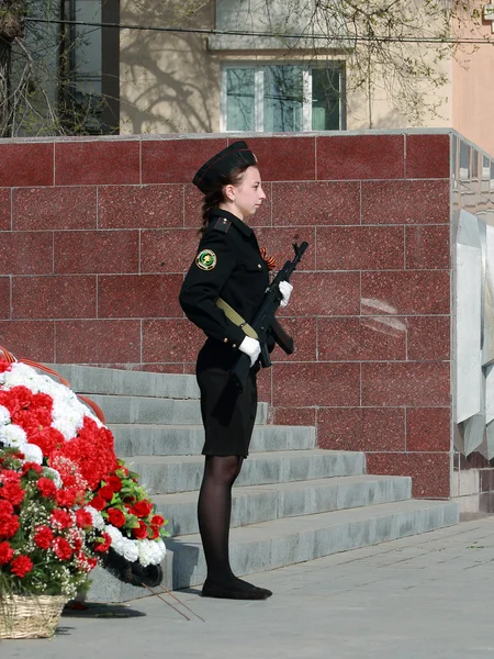 Cadet with a gun on watch at the eternal flame