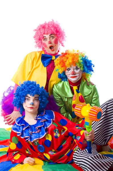 Three colorful funny clown on a white background