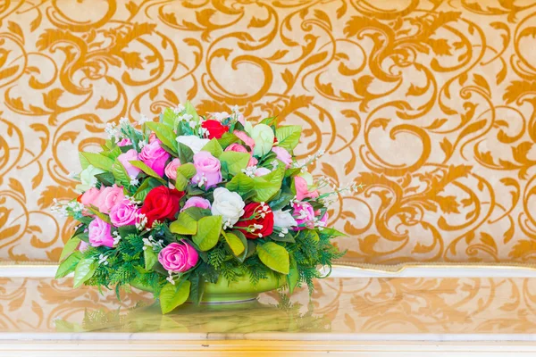 Bouquet flower in the vase in the blurred vintage background