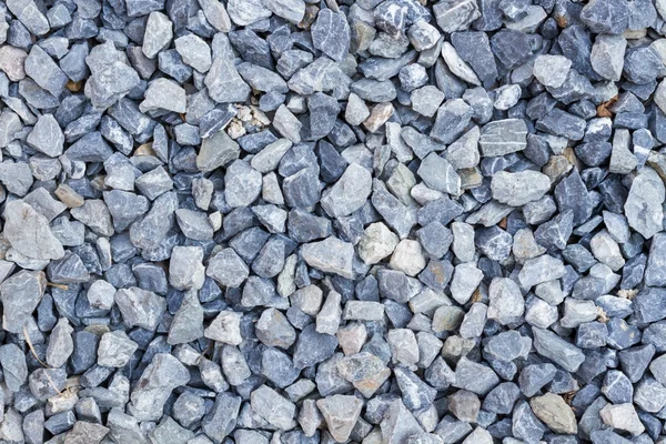 Blue rock texture on the ground, background.