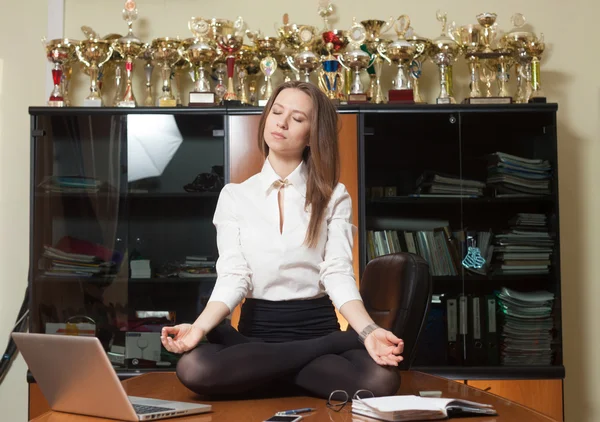 Young beautiful lady making yoga