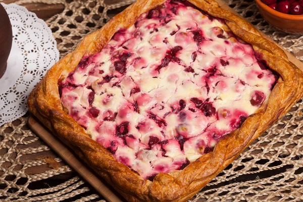 Pie on the table with food set