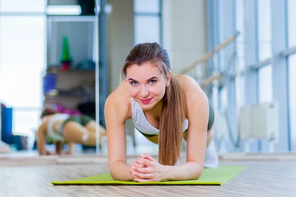 Training fitness woman doing plank core exercise working out for back spine and posture Concept pilates sport