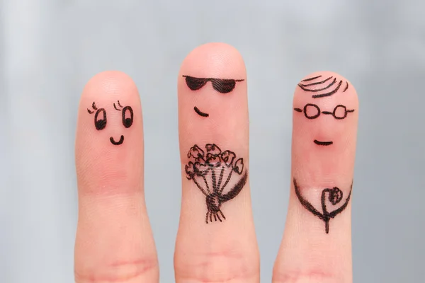 Finger art. Men give flowers flowers to a woman.