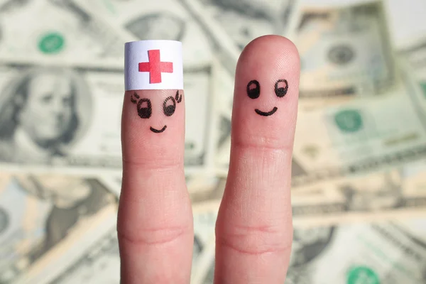 Finger art of a Happy couple. The concept of the doctor and patient on the background of dollars.