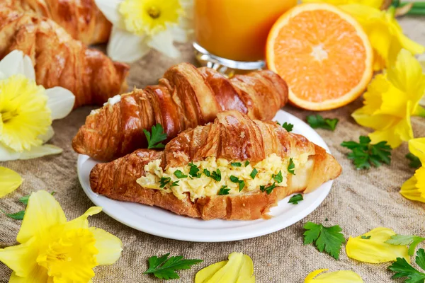 Summer Morning Breakfast Croissant stuffed scrambled eggs decorated with flowers.