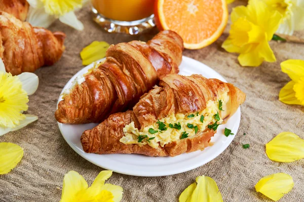 Summer Morning Breakfast Croissant stuffed scrambled eggs decorated with flowers.