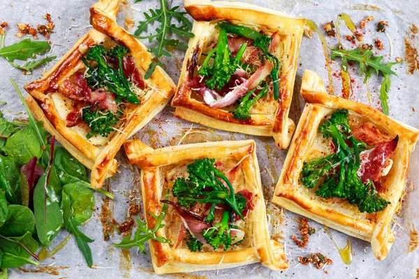 Bacon, cheese, tenderstem broccoli tips puff pastry, with green salad.