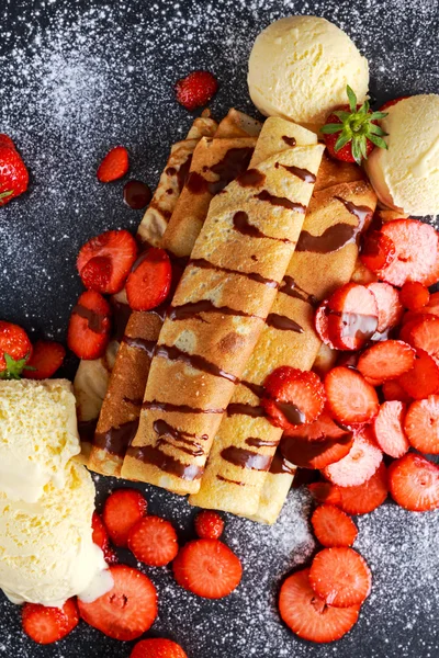Sweet Rolled Pancakes with nutella, strawberry and ice cream