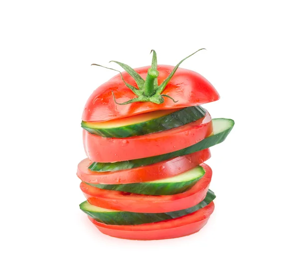 Stack of Cucumber and Tomato slices isolated on white
