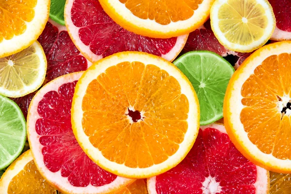 Fresh Orange, Grapefruit, lime, yellow lime juicy slices. Rich with vitamin C. background