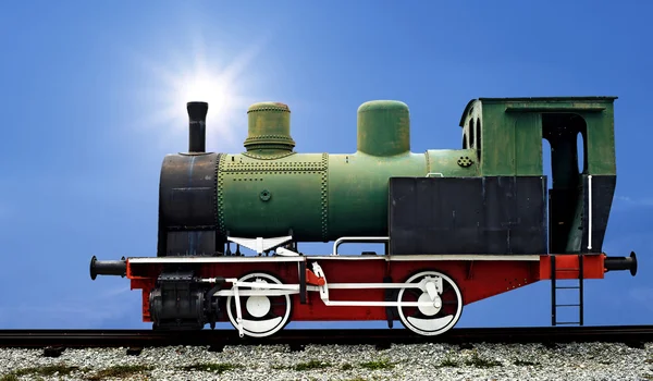 Old steam engine locomotive train on beautiful sky background