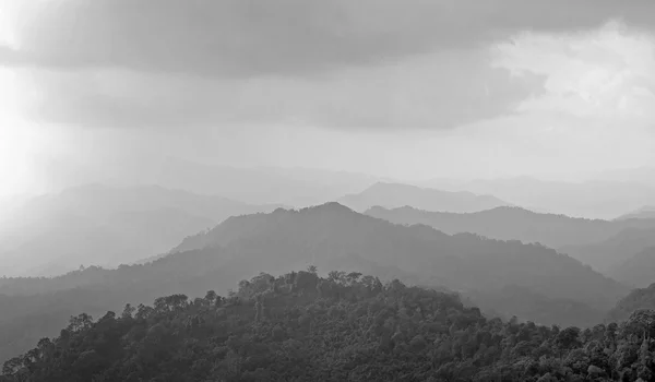 Misty mountain hills landscape, layers of mountains with fog