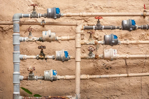 Group of pipes with controls in factory