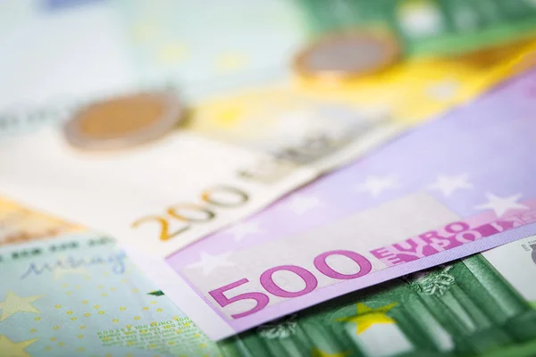 Closeup of euro banknotes and coins