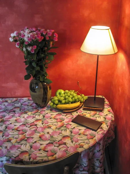 Corner table with flowers and lamp light