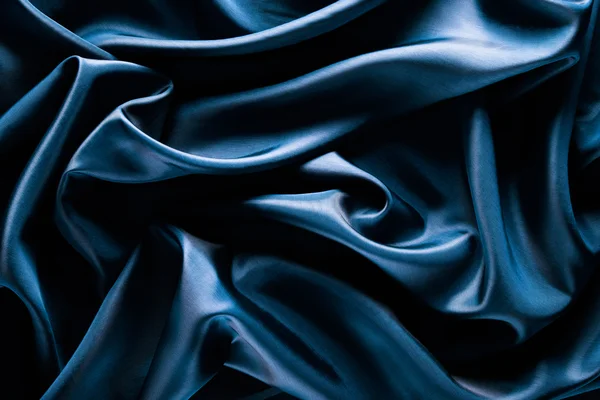 Abstract wave textile texture or background in blue color
