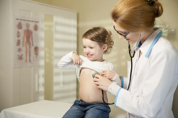 Cute little girl and doctor