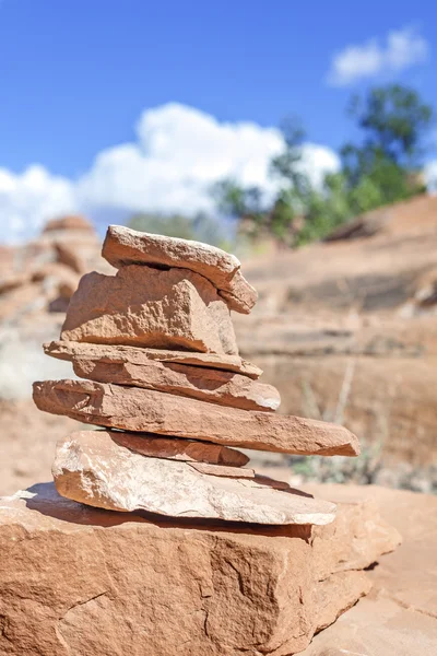 Trail marker made of stones, shallow depth of field, USA.