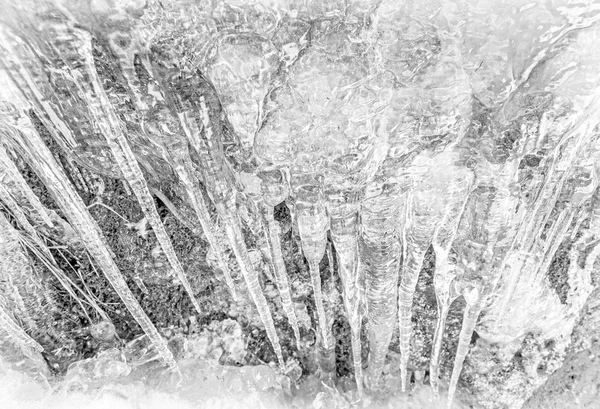 Abstract black and white background made of icicles