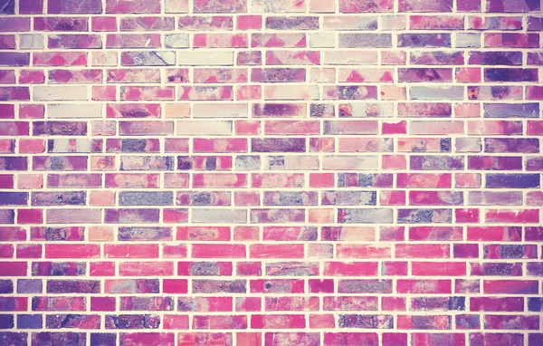 Grunge brick wall  background with vignetted corners.