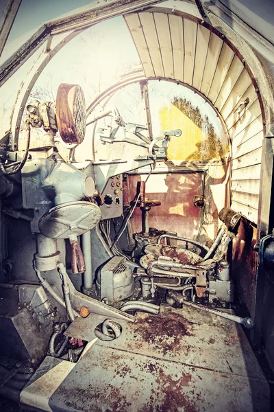 Retro filtered picture of machine gun cockpit.