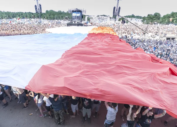 Polish flag spread with audience to commemorate the 71st anniversary of the Warsaw Uprising.