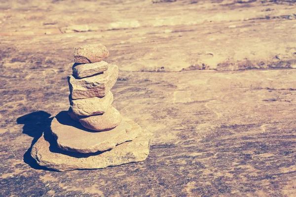 Vintage toned stone pyramid symbolizing harmony and balance.