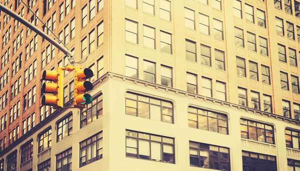 Retro stylized photo of traffic lights in New York City.