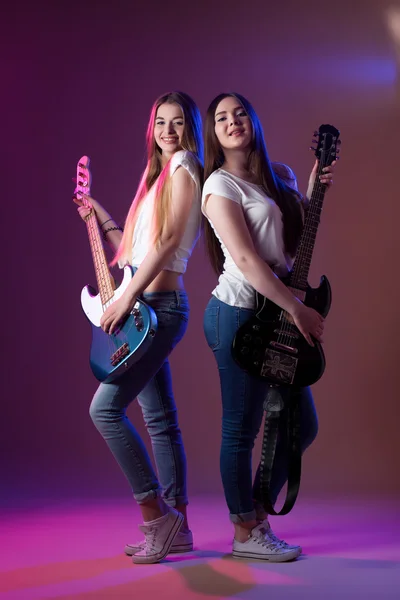 Two girls with musical instruments, music female artist.