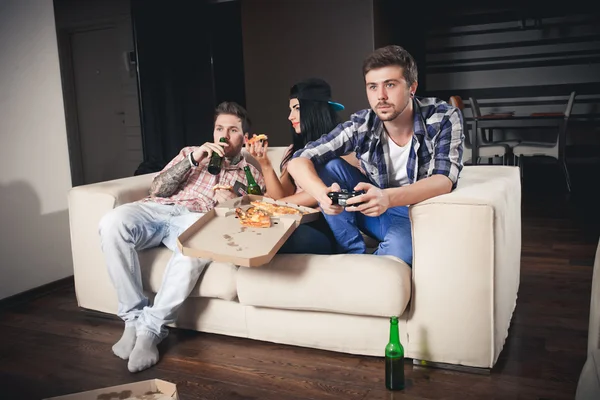 Playing video games while sitting on sofa