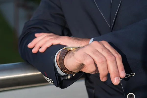 The man with the watch before meeting.