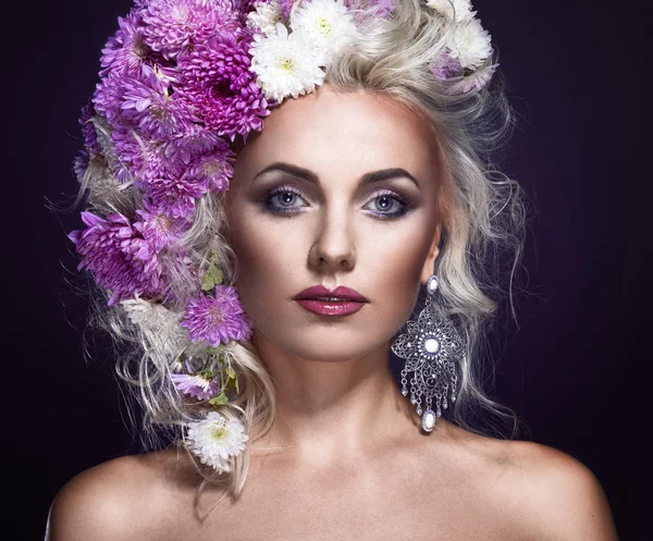 Beauty foto of a woman with flowers in hair, art fantasy portrai