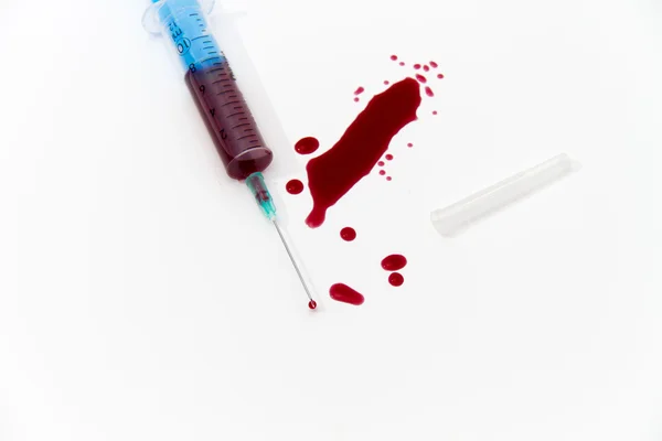 Syringe of Red Blood Test for research HIV AIDS Concept Idea
