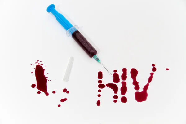 Syringe of Red Blood Test for research HIV AIDS Concept Idea