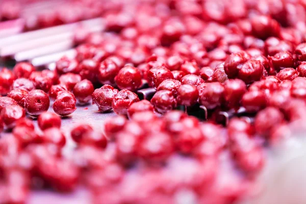 Sour cherries in processing machines