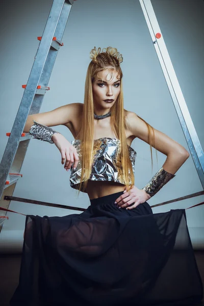 Studio shoot of futuristic woman with creative make-up and hairs
