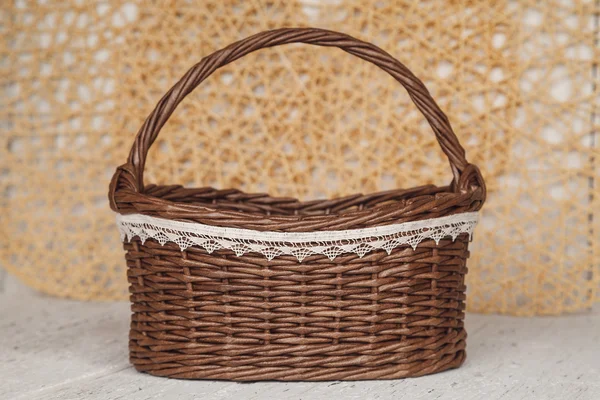 Empty wicker brown basket  for fruit and bread in cousy backgrou