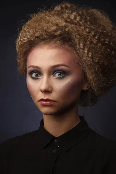Studio classic portrait of beauty woman with creative make-up an