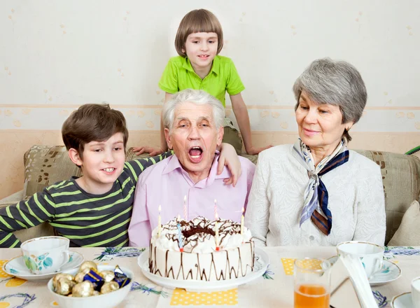 Senior man with holiday cake