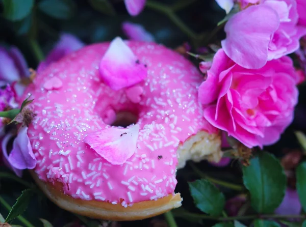 Doughnut with pink glaze and roses