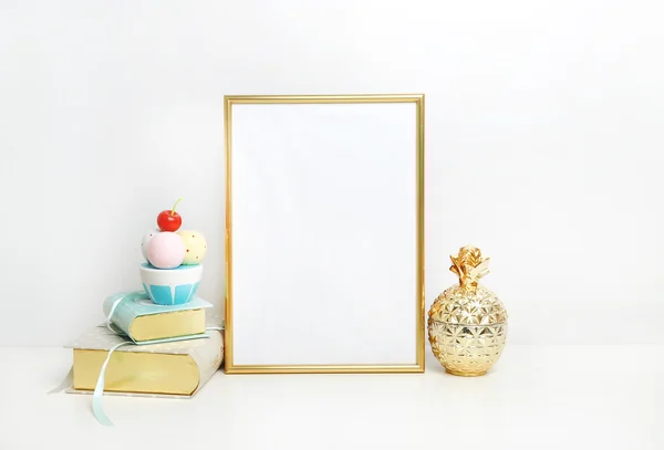 Frame mockup. Place your work. Golden pineapple and book with ice cream. Template print art, shabby style, white background.