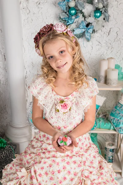 Pretty little girl near the new year tree